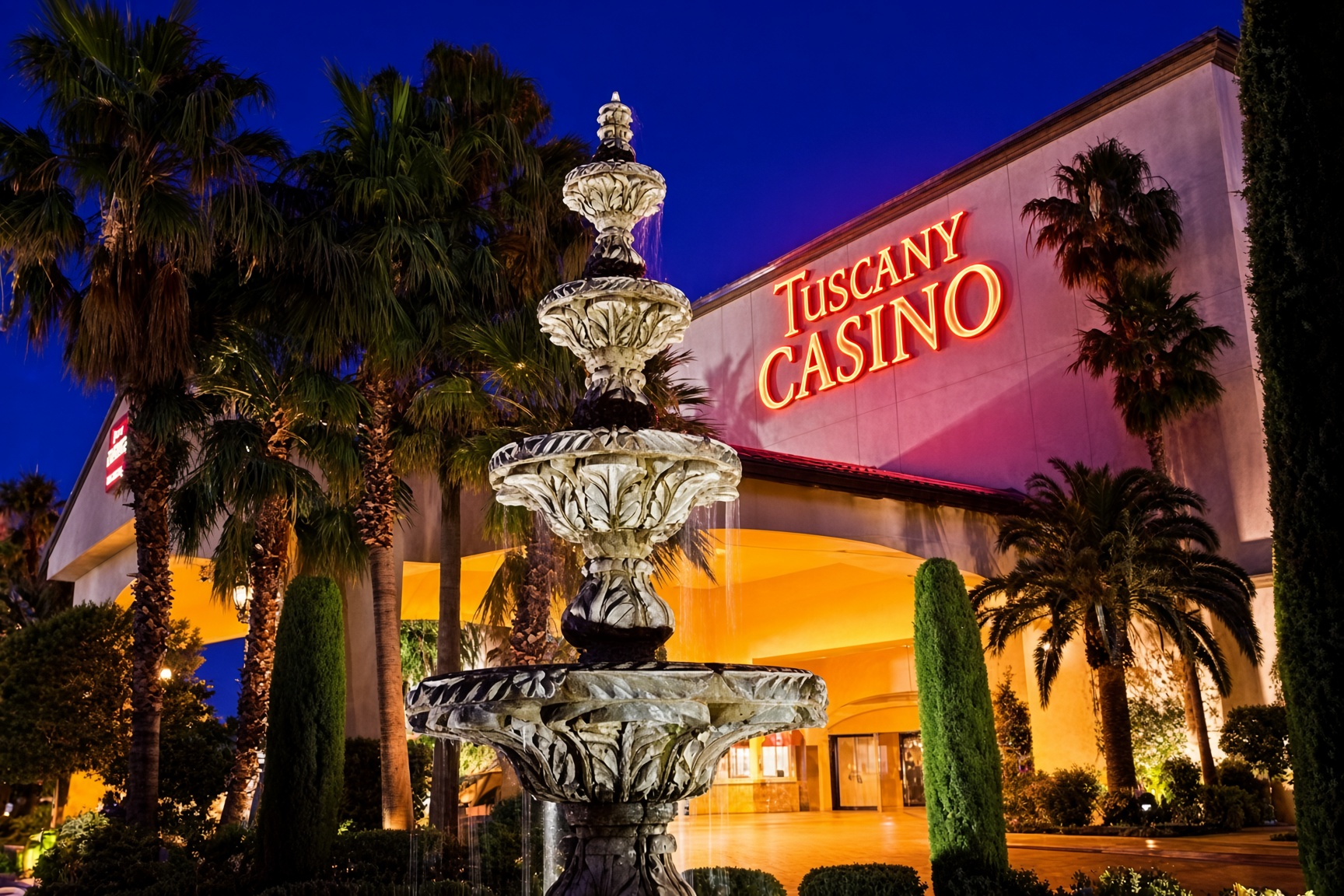 Tuscany Casino at night, fountain and palms